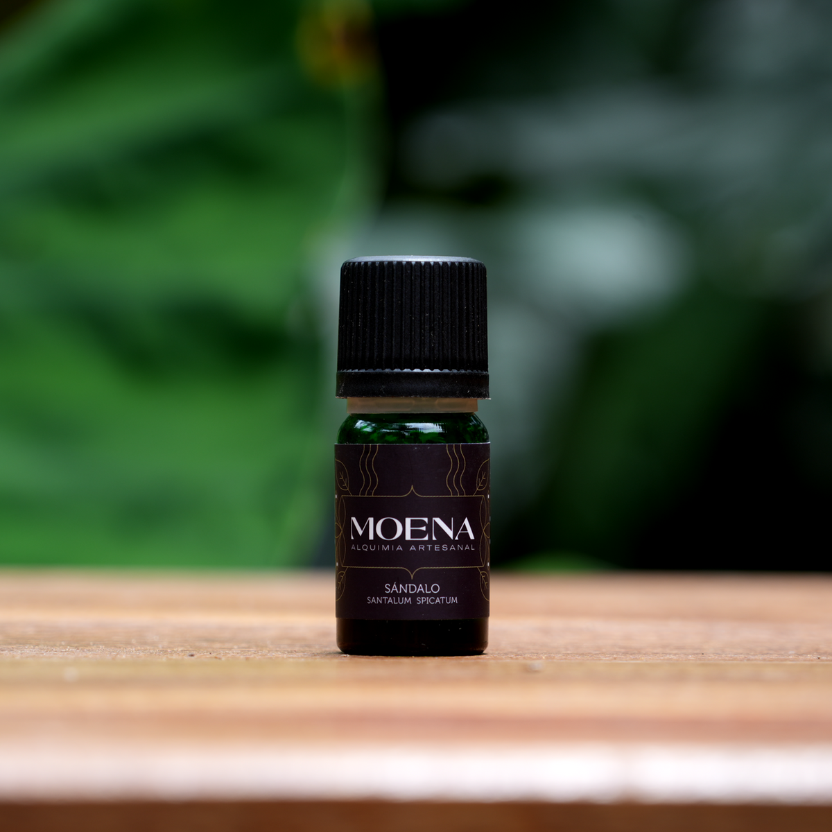 Small bottle of Australian Sandalwood Essential Oil on wooden table