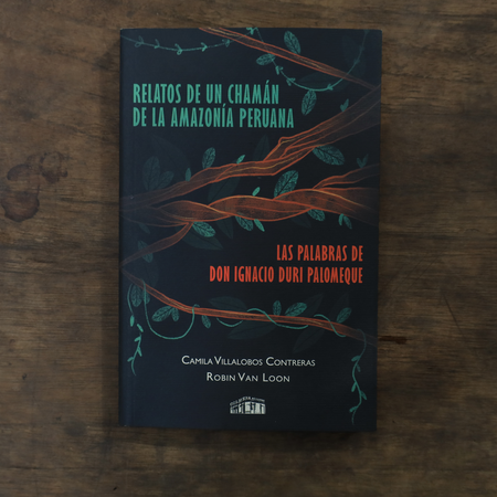 Book cover with tree design on a wooden surface