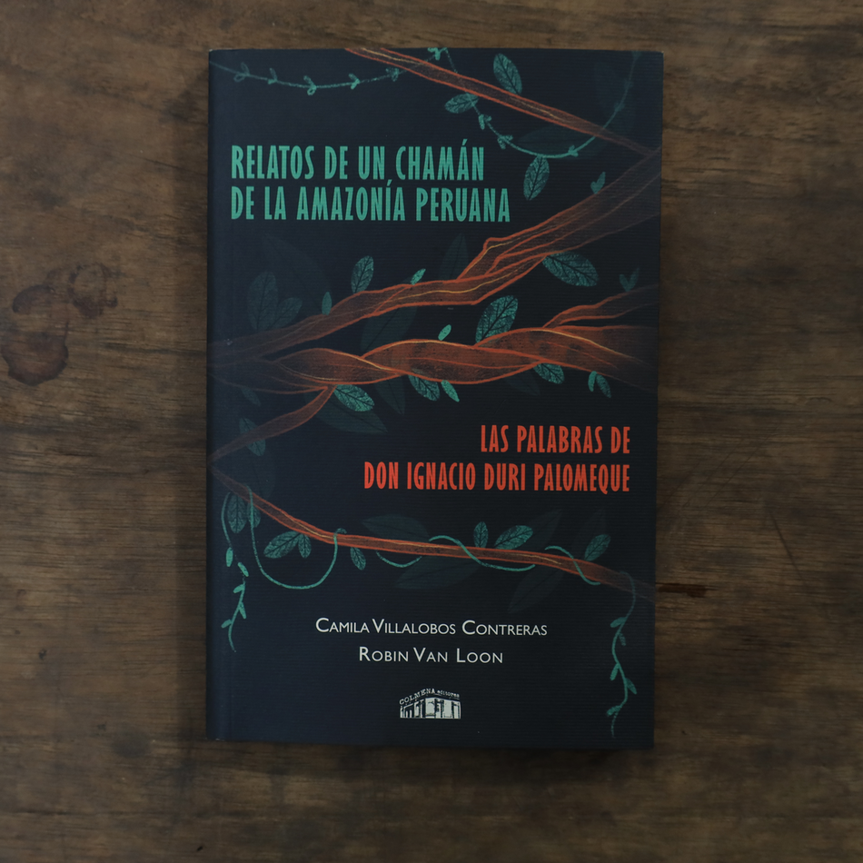 Book cover with tree design on a wooden surface